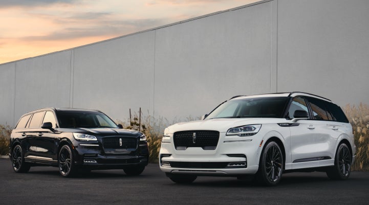 Two Lincoln Aviator® SUVs are shown with the available Jet Appearance Package | Sheehy Lincoln of Richmond in Richmond VA