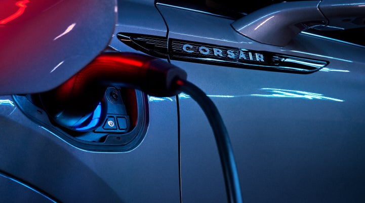 A charger plugged into the charging port of a 2024 Lincoln Corsair® Plug-in Hybrid model. | Sheehy Lincoln of Richmond in Richmond VA